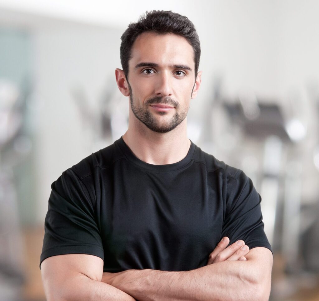 Personal trainer at Third Level Fitness guiding a strength training session in Clayton, NC